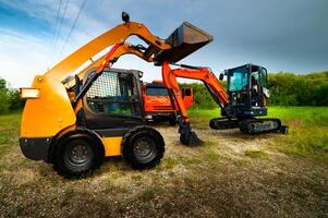 yellow-excavator-and-truck-against-green-forest-construction-equipment-sale-of-special-equipment-photo