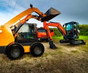 yellow-excavator-and-truck-against-green-forest-construction-equipment-sale-of-special-equipment-photo